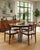 A stunning and matching set of 4 fully refurbished vintage dining chairs, featuring rich dark-toned solid wooden frames...