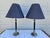 A classic pair of brass and navy-blue table lamps with matching blue shades. This pair of lamps are in very good vintage...