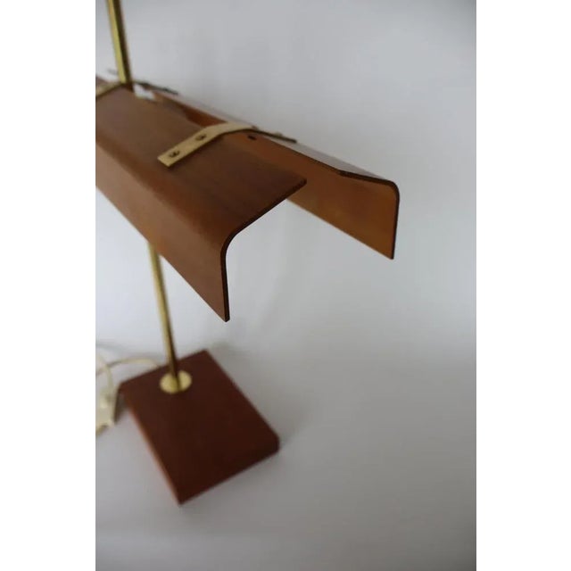 1960's desk or tablelamp in wood and brass. Foot is made in teakwood Shade is made out of teak-plywood. Very fine quality...