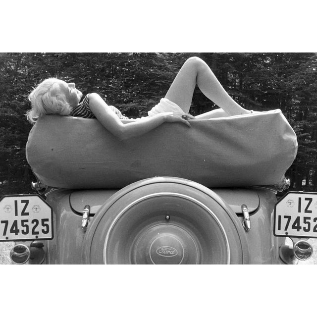 Peter Cornelius, Sunbathing on a Ford, 1938 / 2025, Photograph For Sale