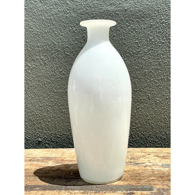 This elegant Mid-Century Modern vessel is a masterclass in minimalist design, featuring a graceful, elongated silhouette...