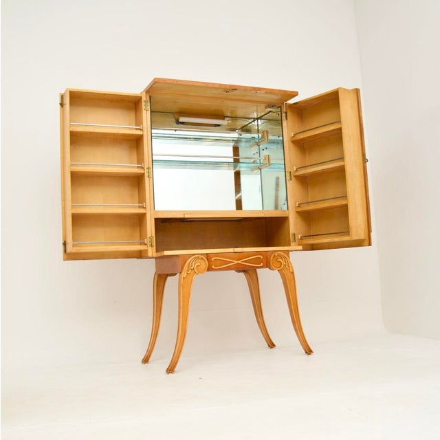 A stylish and exceptionally well made Art Deco burr walnut cocktail cabinet by Hille, dating from he 1930’s. This is of...