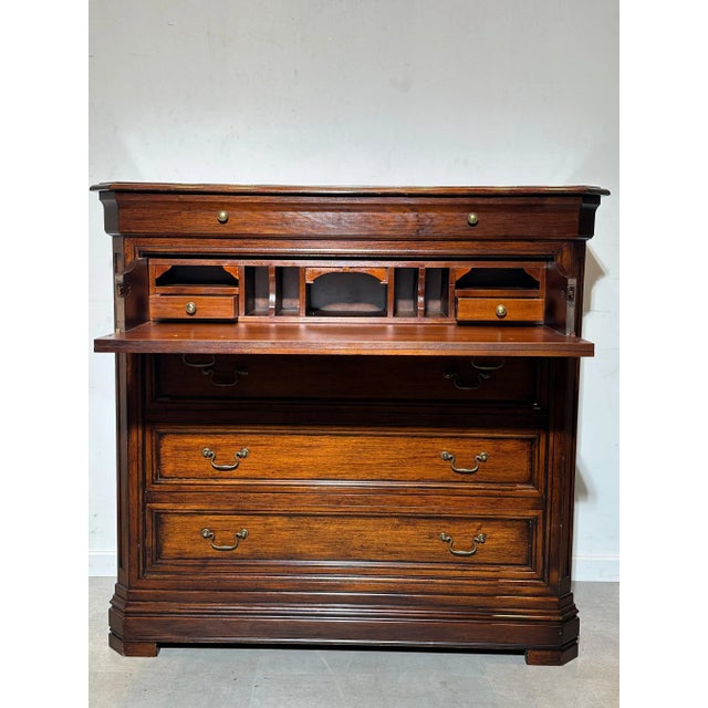 Elevate your interior with this beautifully crafted antique wooden secretaire chest of drawers. Made from rich, solid wood...