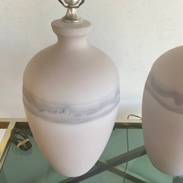 Great pair of large textured ceramic lamps in a light lavender color have an intricate detail of different colors. This...