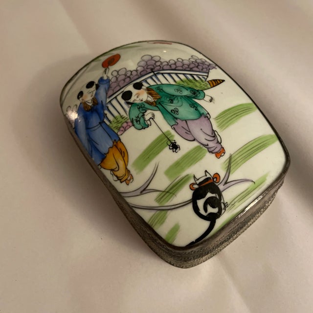 Beautiful antique Chinese Porcelain shard or shred that has been mounted in an embossed silvered metal to form a useful...