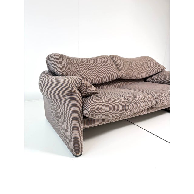 An iconic italian design classic: the maralunga two-seater sofa, designed in 1973 by vico magistretti for the renowned...