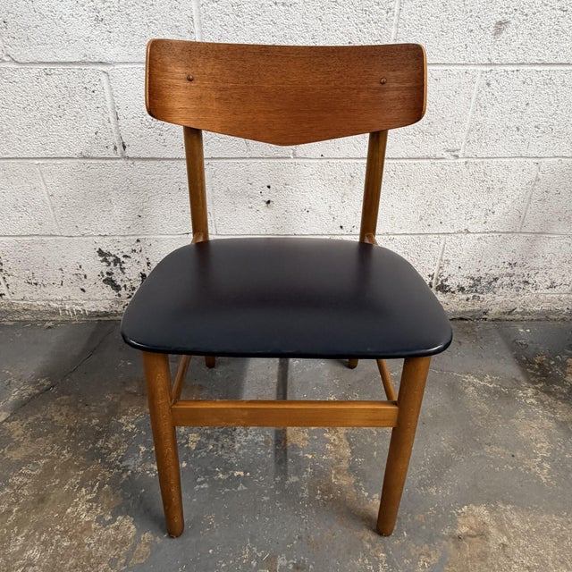 This set of four Danish teak dining chairs by Farstrup has a great clean mid-century look, with warm wood frames, curved...