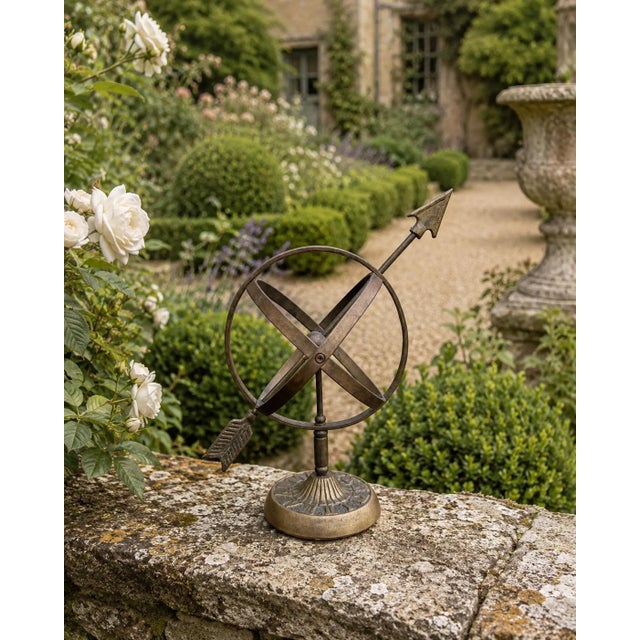 A beautifully crafted iron armillary sphere, evoking the timeless elegance of classical European gardens. Pieces like this...