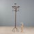 Five-light candle holder with a torchon stand and four arched legs. Anchor decorations. This piece is attributed to the...
