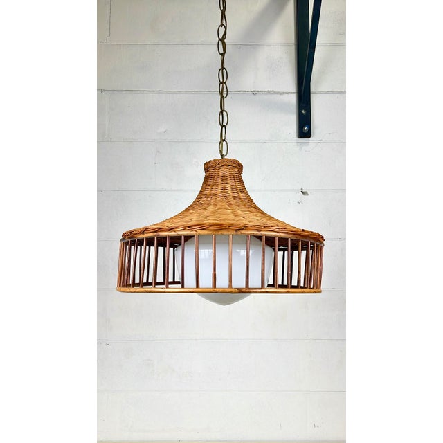 Vintage mid century rattan wicker hanging pendant light. Round pencil reed rattan frame with wicker shade top. Plug in...