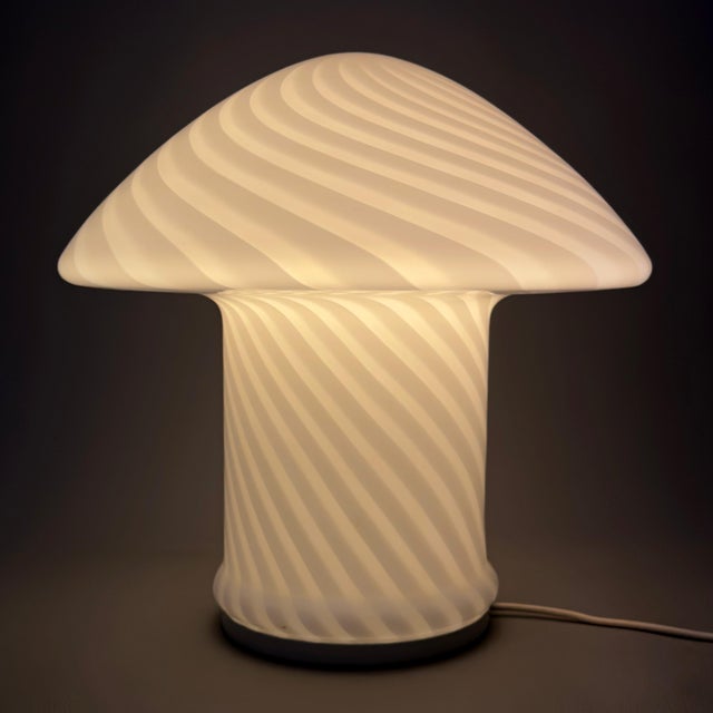 A stunning and iconic mushroom-shaped blown glass table lamp with a swirl motif, an expression of the finest Space Age...