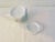 Charming set of ten white ceramic tea bag plates/spoon rests. Four are marked "Fitz & Floyd Everyday." No makers mark.