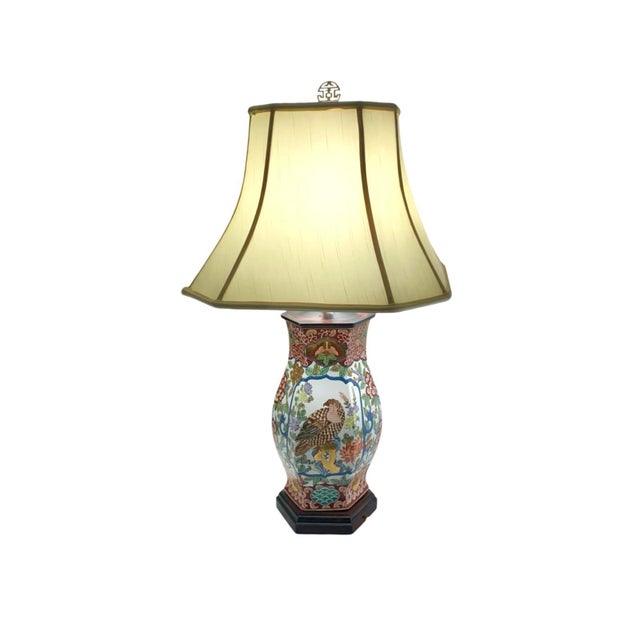 The Japanese Kutani Imari Vintage Porcelain Table Lamp features a beautiful Asian Chinoiserie bird design in red and gold...