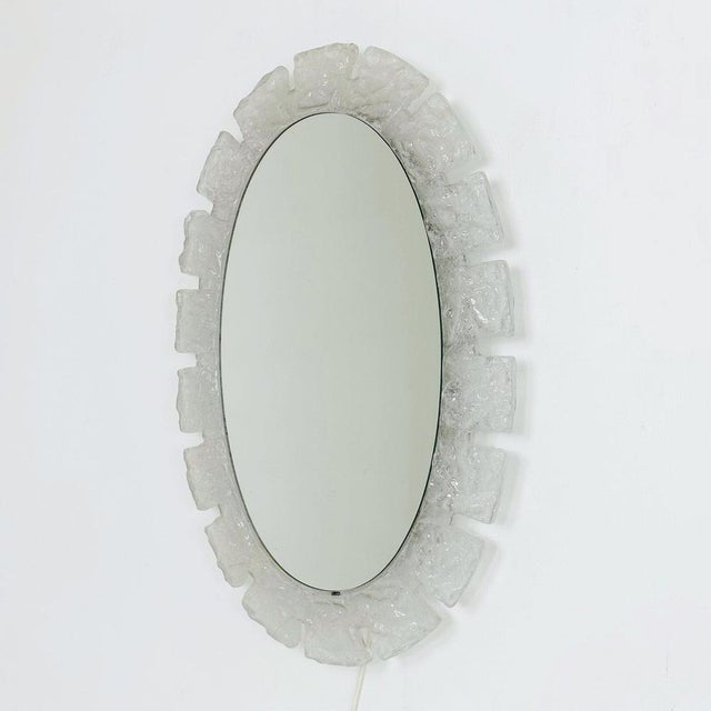 Mid century oval wall mirror with lighting and acrylic glass edge by Hillebrand, 1960s This beautiful oval shaped mirror...