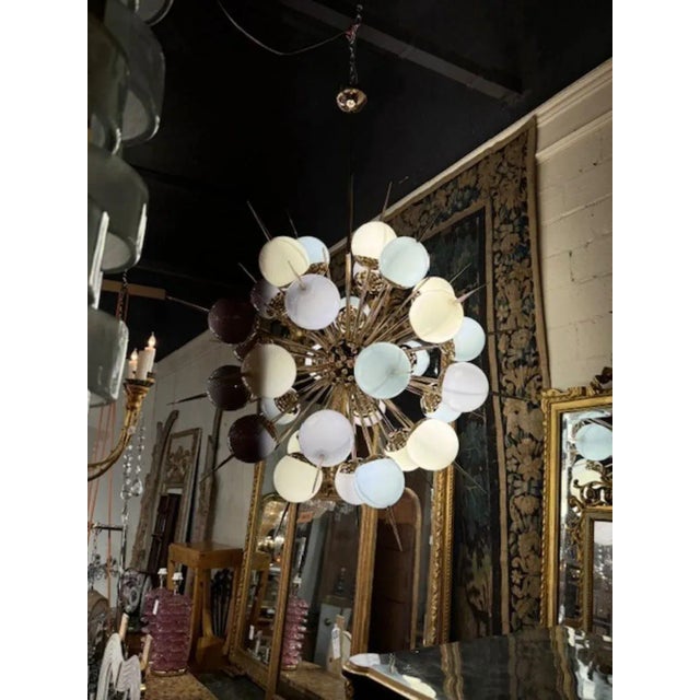 Exceptional modern Murano glass multi color pastel globe sputnik chandelier. Circa 2000. The chandelier has been...