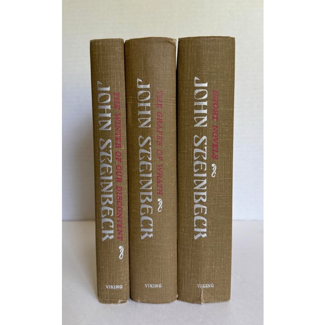 Here is a handsome set of three vintage John Steinbeck hardcover volumes, published by Viking Press and dating to the...