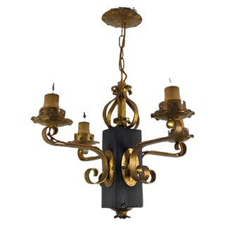 Gilt Wrought Iron and Black Wood Chandelier For Sale