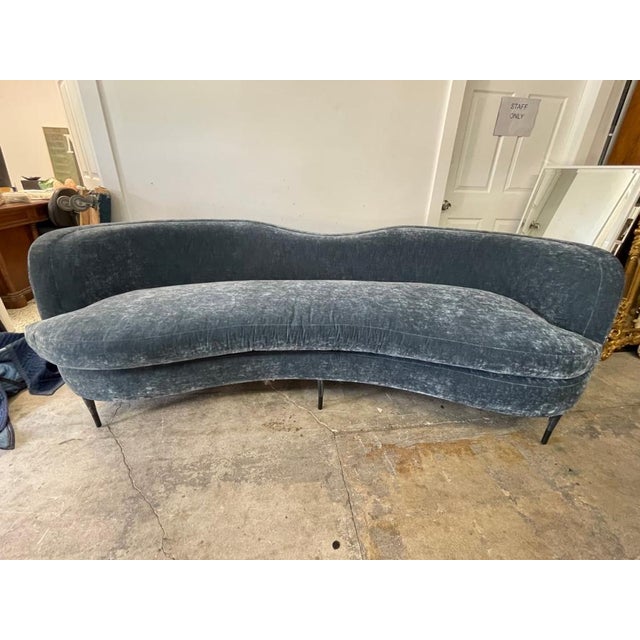 Vincent modern curved upholstered sofa featuring a sculptural silhouette and luxurious custom mali denim velvet fabric....