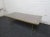 Quaint coffee table on the smaller side. It's tapered brass legs give it an elegant look. This has a glass table top...