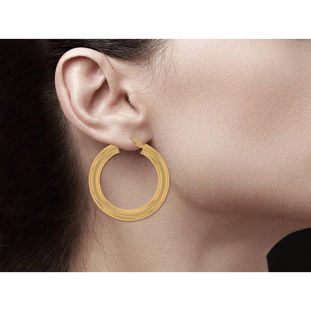 ♥ Product Summary ♥ Details: Polished Hollow Hoops Metal: 14K Yellow Gold Size: 28mm/1 inch Weight: 4 grams Width: 4mm...