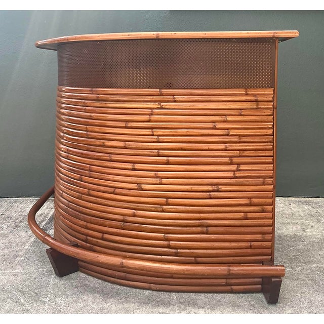 This striking vintage boomerang-shaped dry bar is a quintessential piece of Tiki and Mid-Century Modern design....