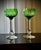 A pair of french saint-louis massenet crystal hock wine glasses with green cut-to-clear bowls, estimated to date to the...