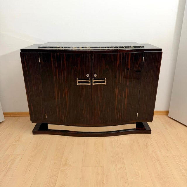 Elegant, small Art Deco sideboard or buffet in lacquered Macassar from France, circa 1930. Classic French design with...