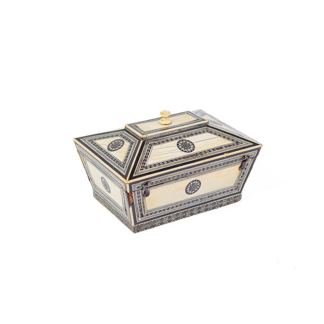 Anglo-Indian export box in the classic sarcophagus form, veneered in bone with fine ebony line inlay and bordered in...