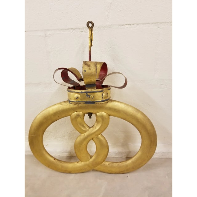 Great Danish Pretzel Sign with metal crown and cross...the pretzel is carved wood with gold leaf finish.