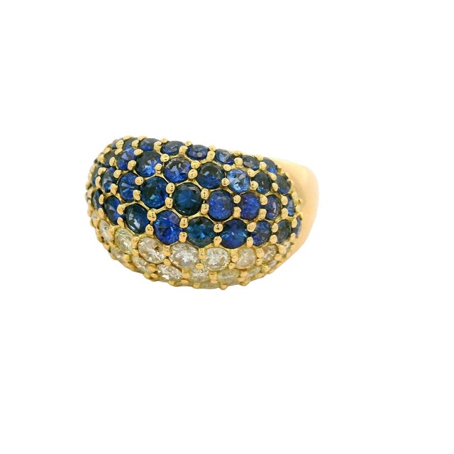 A striking fashion ring featuring a captivating array of round blue sapphires, totaling 2.15 carats. These vibrant stones...