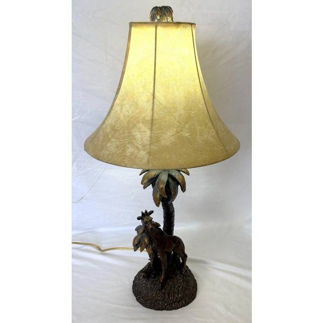 Great little vintage table lamp with coastal safari vibes. The piece is made of composite material and depicts a giraffe...