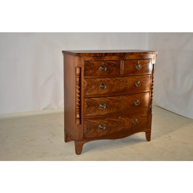 19th century mahogany bow front chest of drawers from England. This chest has fantastic graining and color throughout. The...
