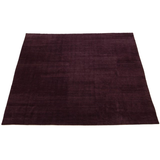 This contemporary Tibetan weave rug features a captivating striped pattern in shades of purple that draws the eye. Made...