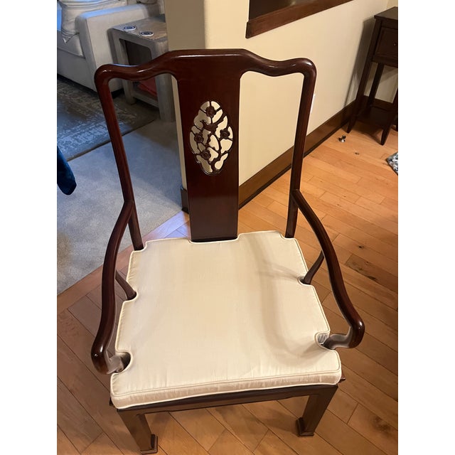 Solid rosewood dinning table with eight chairs. We are the original owners. Table and chairs are in excellent condition.
