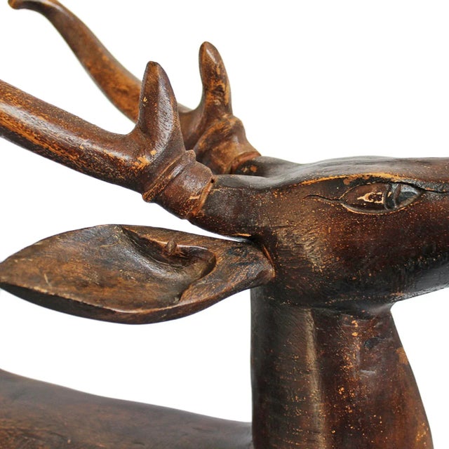 Antique hand carved wood deer statue from Java, Indonesia. Beautiful hand carved details and rich patina. Standing proud...