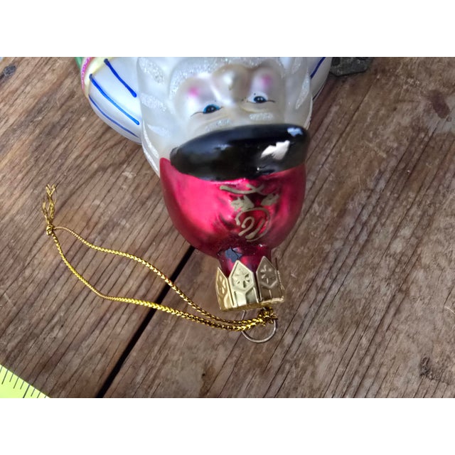 Description: A beautiful heirloom-quality vintage mouth-blown glass Christmas ornament crafted by the world-renowned...