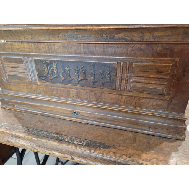 This antique treadle sewing machine by the Davis Sewing Machine Company of Dayton, Ohio, is a compelling example of late...