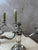 An elegant pair of four-arm silver-plated metal candlesticks dating from the 1940s, with a refined design inspired by...