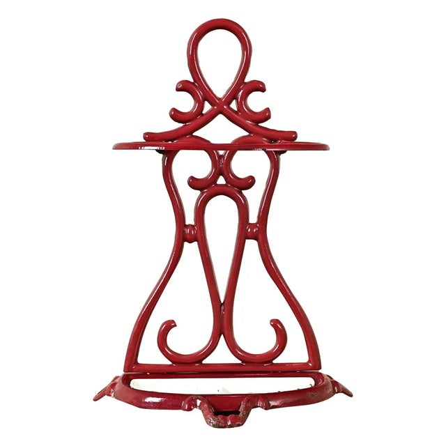Dimensions: 27 ⅛” H x 18 ¾” W x 9 ⅜” D A calligraphic French Art Nouveau umbrella stand, made of cast iron enameled in a...