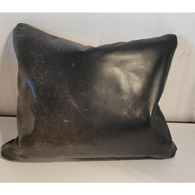 Early geometric weaving pillow with a black leather backing.The insert is down & feather fill.