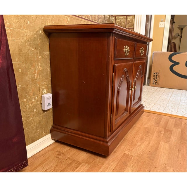 Traditional cherry buffet/server offering both functionality and classic styling. This versatile piece can serve as a...