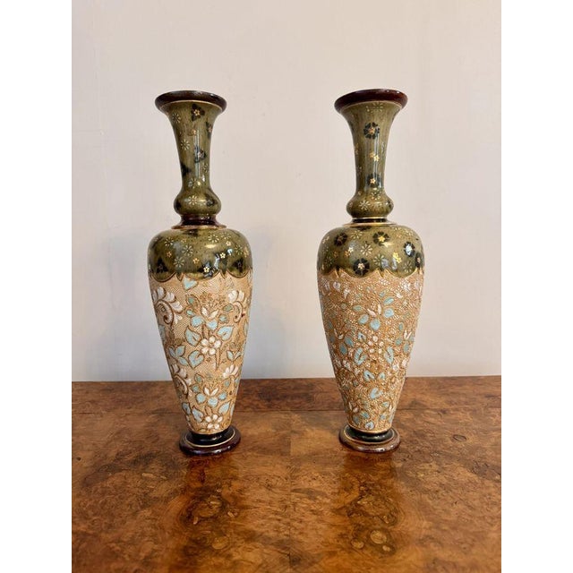 Elegant quality pair of antique Doulton Lambeth vases, having a quality pair of antique Victorian Doulton Lambeth vases...