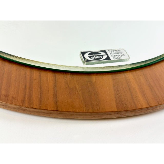 Mid-Century Modern Wall Round Mirror in Teak from Elite, 1970s, in Very Good conditions. Designed 1970 to 1979 This piece...