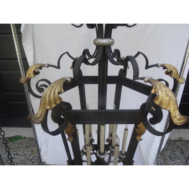 An extra large 12 light wrought iron lantern with both silver and gold gilt highlights. It could have glass panels if...
