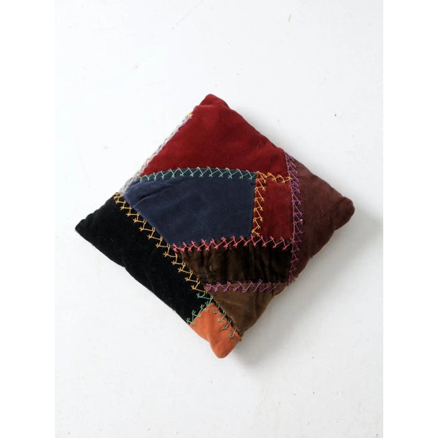 This is a vintage throw pillow featuring a Victorian era "crazy" quilt textile. The petite decorative pillow features a...