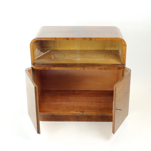 Exceptional and fully restored sideboard from the late Art Deco period, combining elegant functionalist design with...