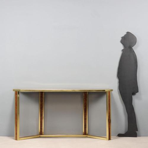 Wall console table with brass structure and briar root inserts, notched top in smoked glass. This piece is attributed to...