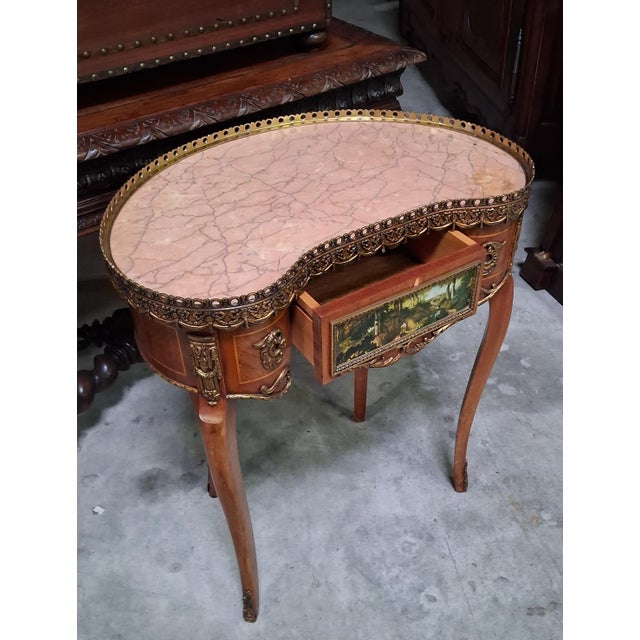 Louis xv style bean-shaped desk in marquetry and gilt bronze an elegant louis xv style bean-shaped desk, crafted from...