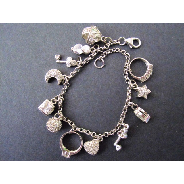 Sterling Silver Charm Bracelet Acid Tested: 925 Silver Length 7 inches 12 Charms Weight: 22 grams