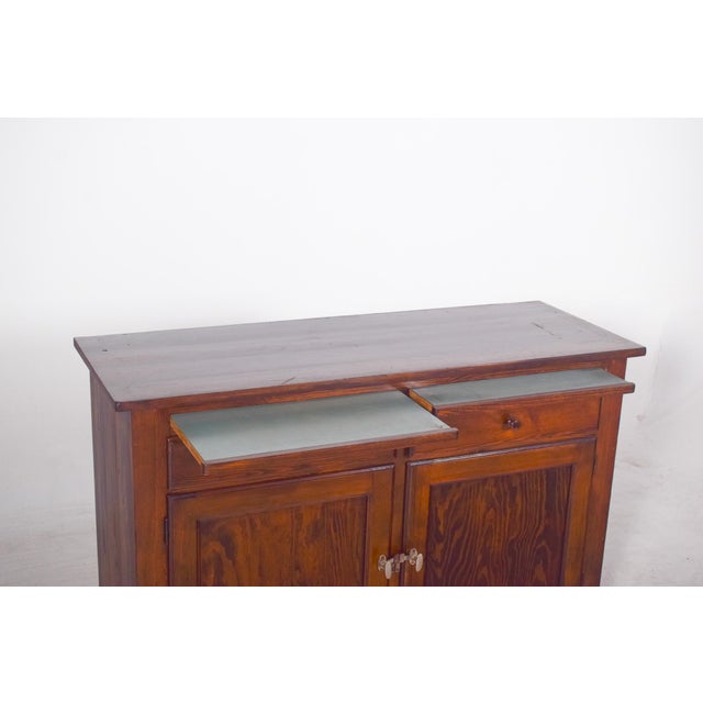 Two-body display cabinet. An imposing and functional piece characterised by the beauty of solid wood and the harmony...